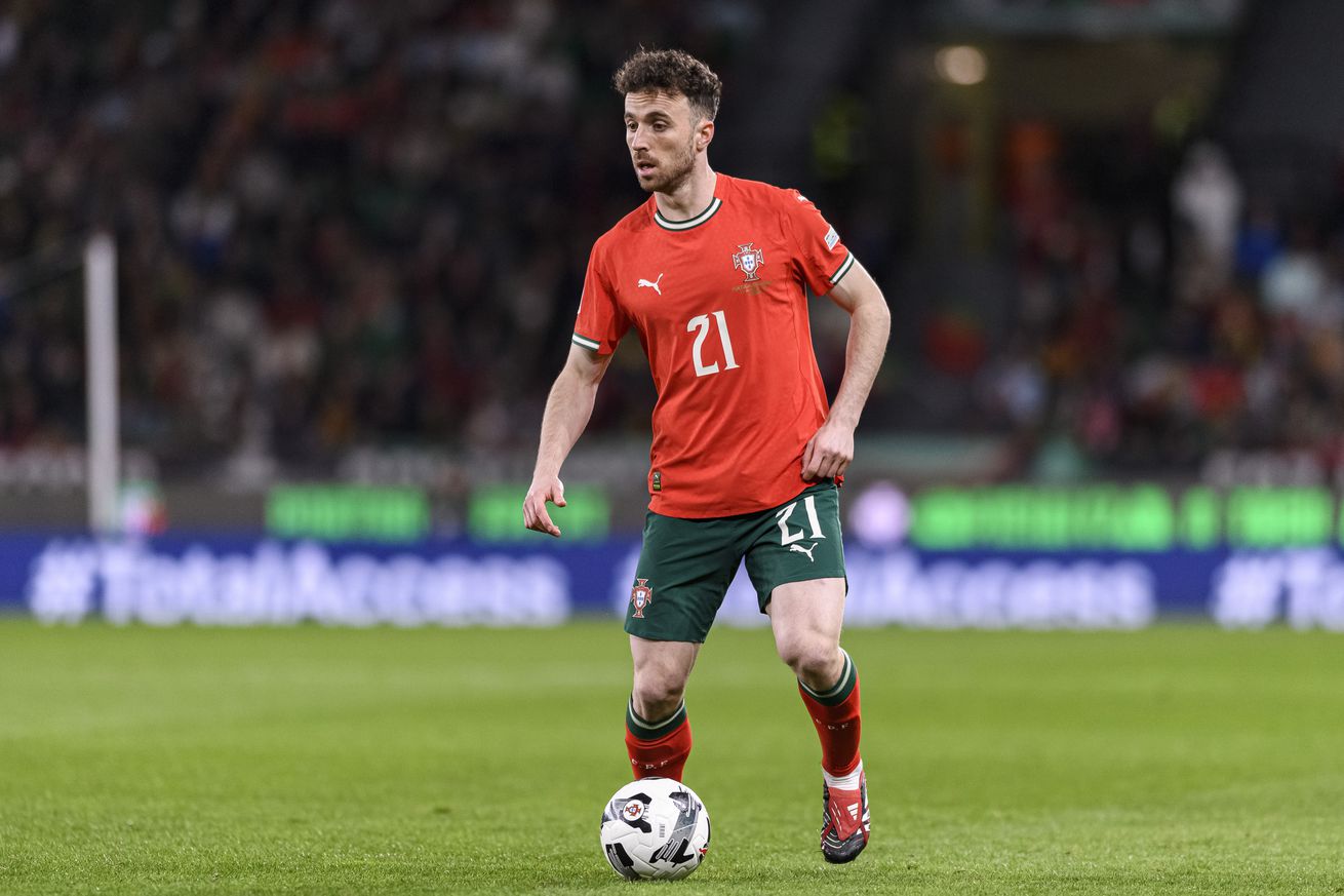 Diogo Jota of Portugal runs with the ball during the UEFA Nations League Quarterfinal Leg Two match between Portugal and Denmark at Estadio Jose Alvalade on March 23, 2025 in Lisbon, Portugal.