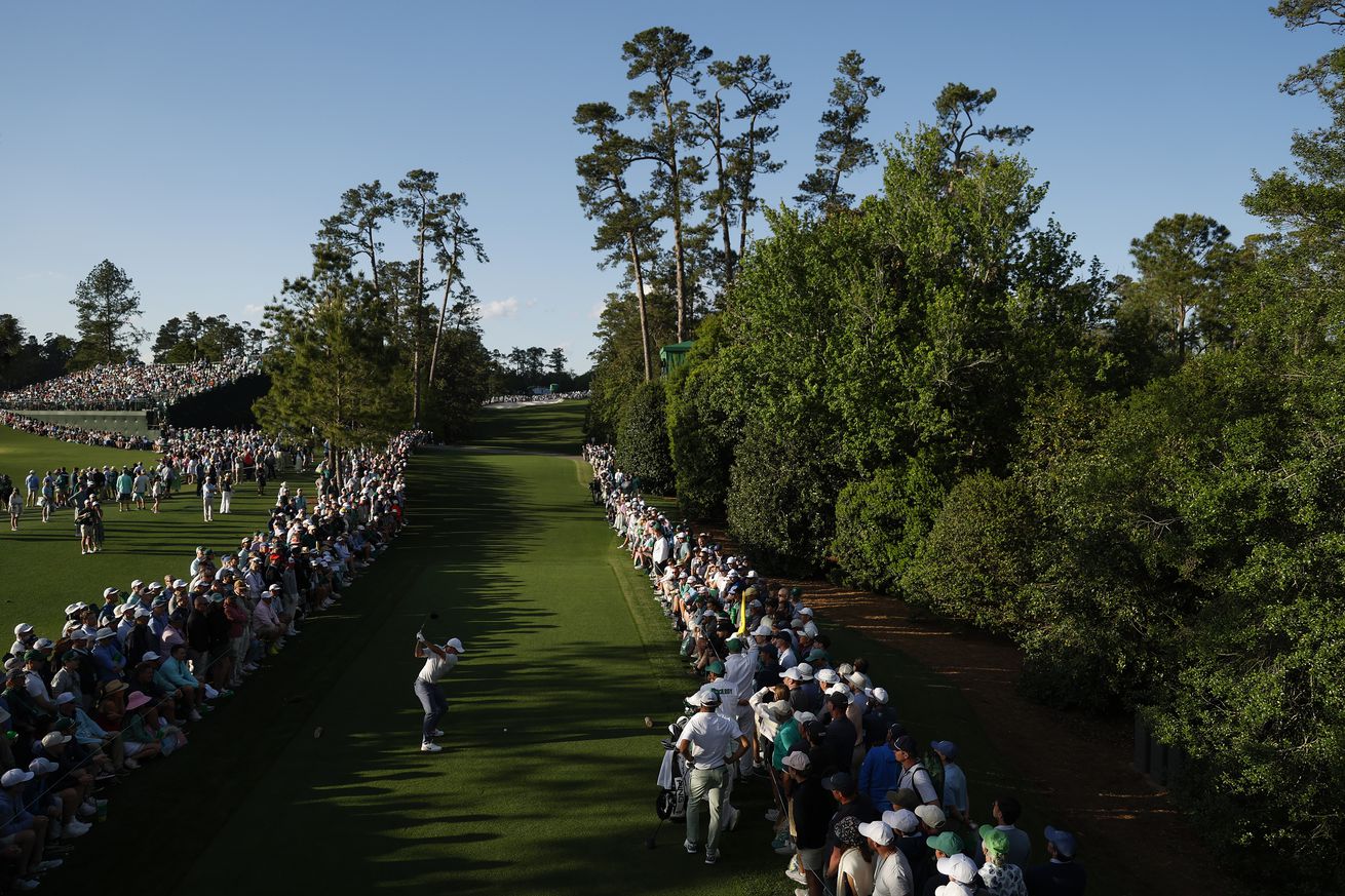 Rory McIlroy of Northern Ireland plays his shot from the 18th tee during the third round of the 2025 Masters Tournament at Augusta National Golf Club on April 12, 2025 in Augusta, Georgia.