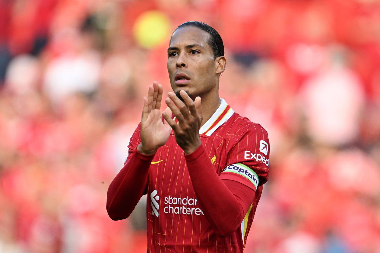 Virgil van Dijk of Liverpool acknowledges the fans after the Premier League match between Liverpool FC and Arsenal FC at Anfield on May 11, 2025 in Liverpool, England.