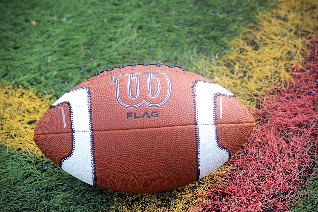 An official Wilson football for flag rests on the field at the Atlantic East Championship for women’s flag football on Saturday, April 26, 2025, in Arlington, Va. 