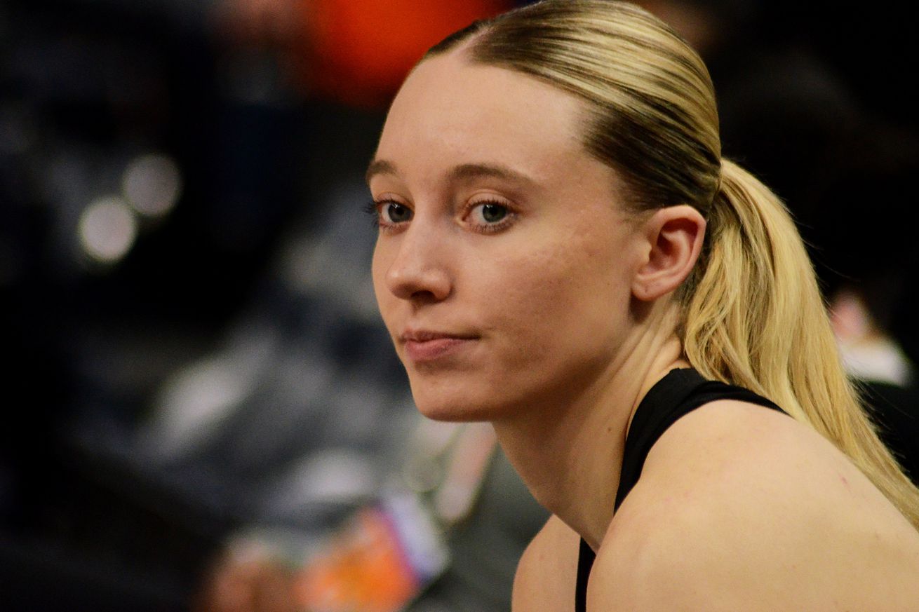 Dallas Wings rookie Paige Bueckers sits on the bench at the Target Center on Wednesday, May 21, 2025, before warming up to play the Minnesota Lynx.