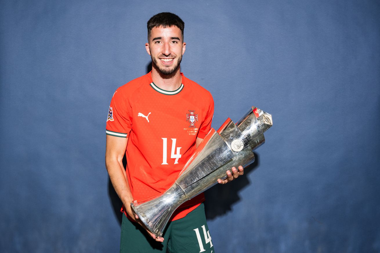 Gonçalo Inácio of Portugal poses for a photo with the UEFA Nations League trophy during the official UEFA Nations League 2025 Winners’ shoot after the UEFA Nations League Final between Spain and Portugal at Munich Football Arena on June 08, 2025 in Munich, Germany.